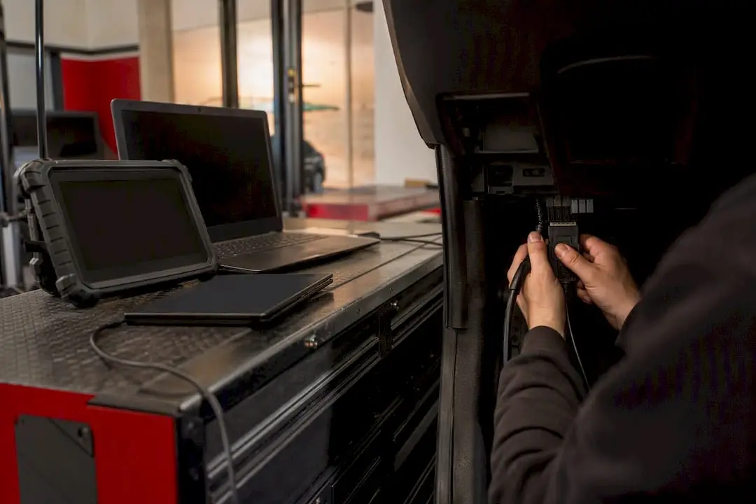 Diagnostic tools and hands connecting cables
